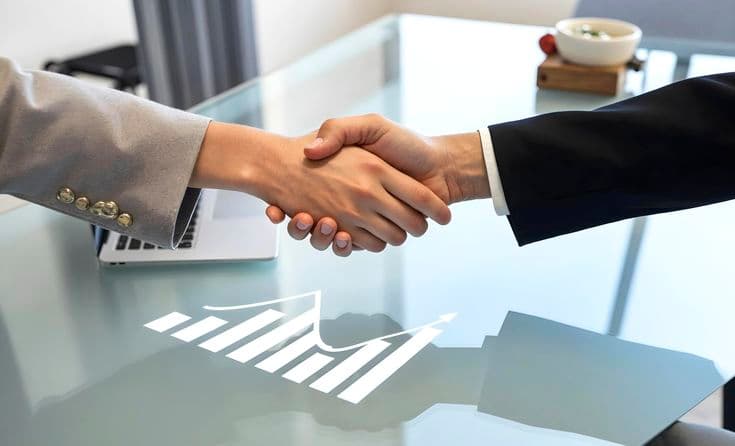 Business professionals sealing a partnership